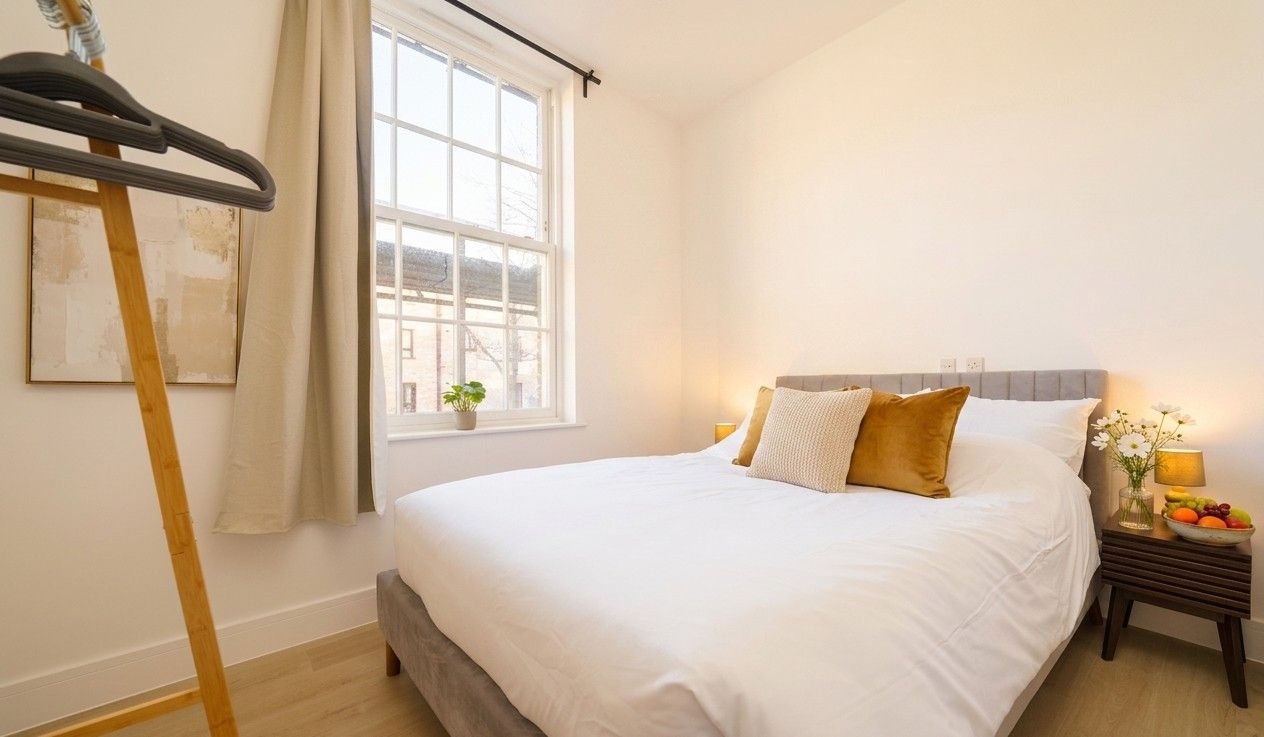 Freshly made double bed with crisp white linen